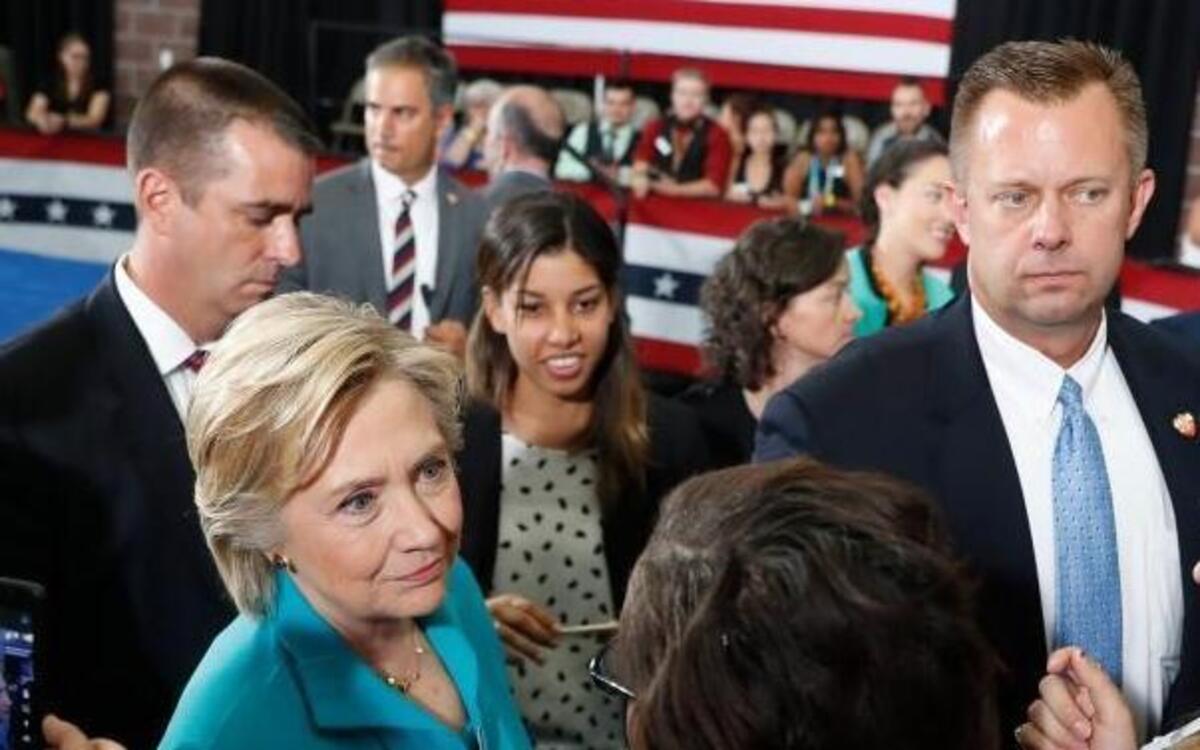 In this Thursday, Aug. 25, 2016, file photo, Democratic presidential candidate Hillary Clinton greets people in the audience after speaking at a campaign event at Truckee Meadows Community College in Reno, Nev. Donald Trump is doing relatively well in Nevada, due to the state of its economy, its large population of non-college graduates and history of ticket-splitting.
