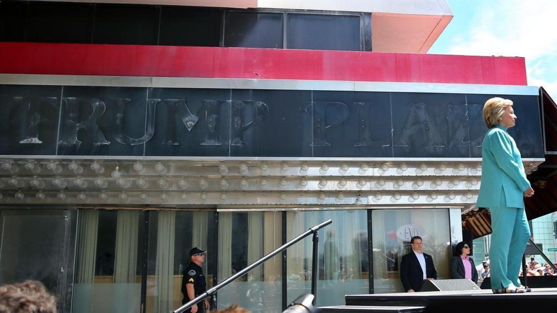 In this July 6, 2016, file photograph, Democratic presidential candidate Hillary Clinton stands near the faded sign of the Trump Plaza casino, which closed permanently on Sept. 16, 2014, as she waits to address a gathering on the Boardwalk in Atlantic City, N.J.
