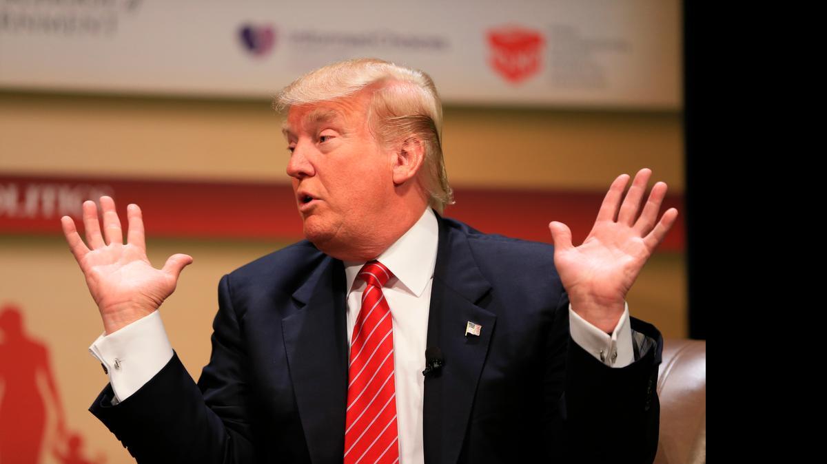 
Donald Trump speaks at Family Leadership Summit in Ames, Iowa, and was dismissive of Sen. John McCain’s war service.

