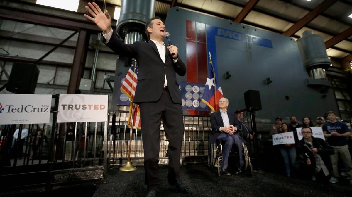 Republican presidential candidate, Sen. Ted Cruz, R-Texas, accompanied by Texas Gov. Greg Abbott, speaks during a rally in Houston.