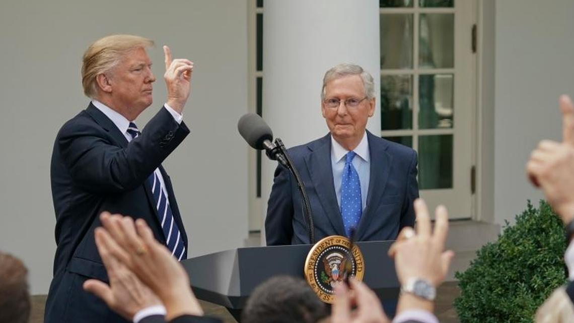 Journalist raise their hands as they wait to called on to ask a question to President Donald Trump and Senate Majority Leader Mitch McConnell of Ky., in the Rose Garden of the White House, Monday, Oct. 16, 2017.