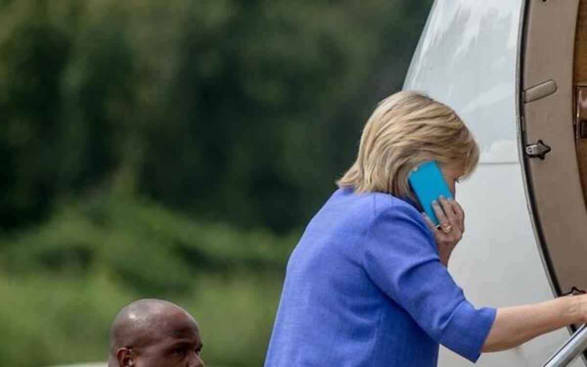 Democratic presidential candidate Hillary Clinton boards her plane at the Cincinnati Municipal Lunken Airport on Wednesday, Aug. 31, 2016, after speaking at the American Legion's 98th Annual Convention.