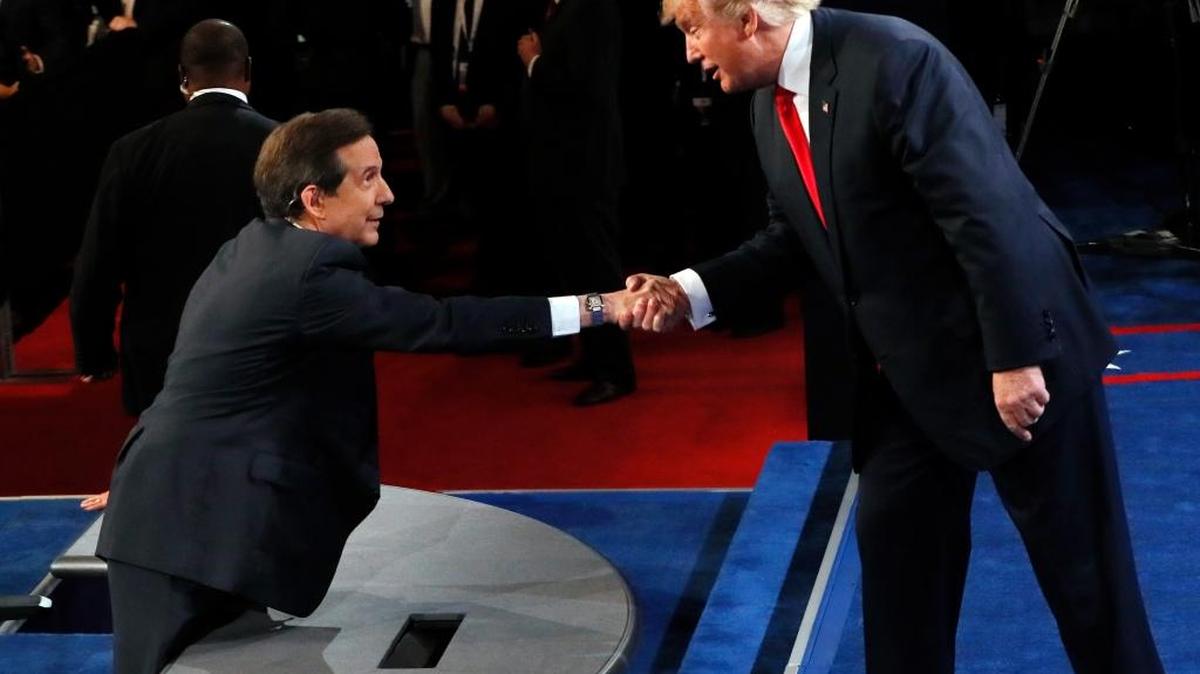 Republican presidential nominee Donald Trump shakes hands with moderator Chris Wallace, of FOX News, after the third presidential debate at UNLV in Las Vegas, Wednesday, Oct. 19, 2016.