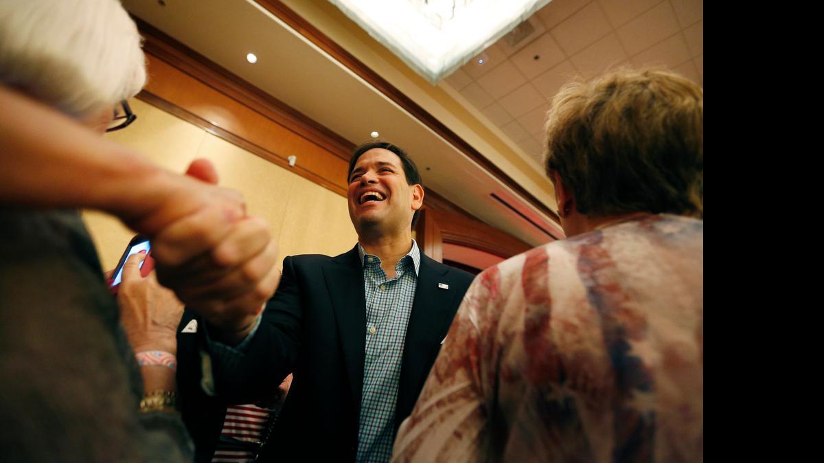 
Republican presidential candidate Sen. Marco Rubio, R-Fla., shakes hands during a campaign event Saturday, July 11, 2015, in Henderson, Nev.
