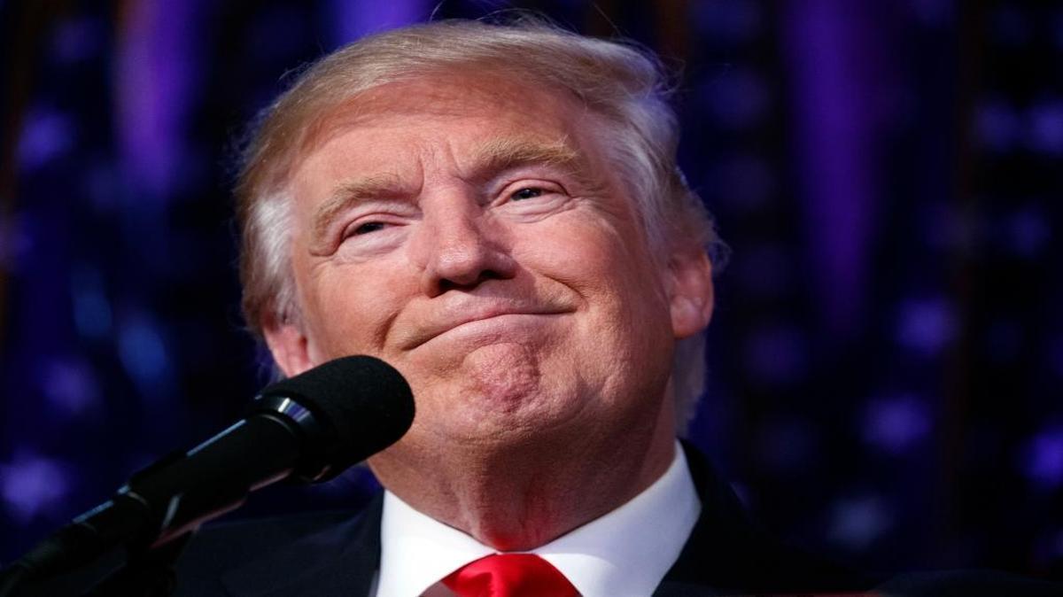 In this Wednesday, Nov. 9, 2016 file photo, President-elect Donald Trump smiles as he arrives to speak at an election night rally, in New York.