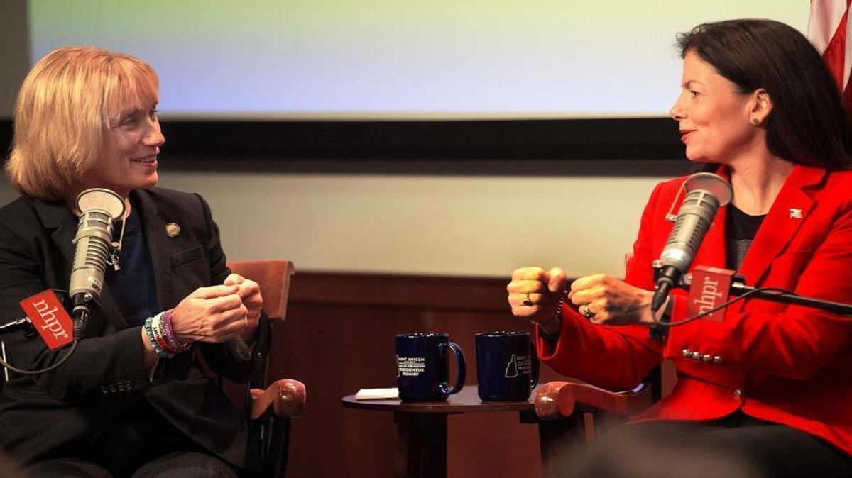 Candidates for U.S. Senate, Democrat Gov. Maggie Hassan, left, and incumbent Republican Sen. Kelly Ayotte joke with each other before a forum with business leaders Tuesday, Oct. 25, 2016, in Manchester, N.H.