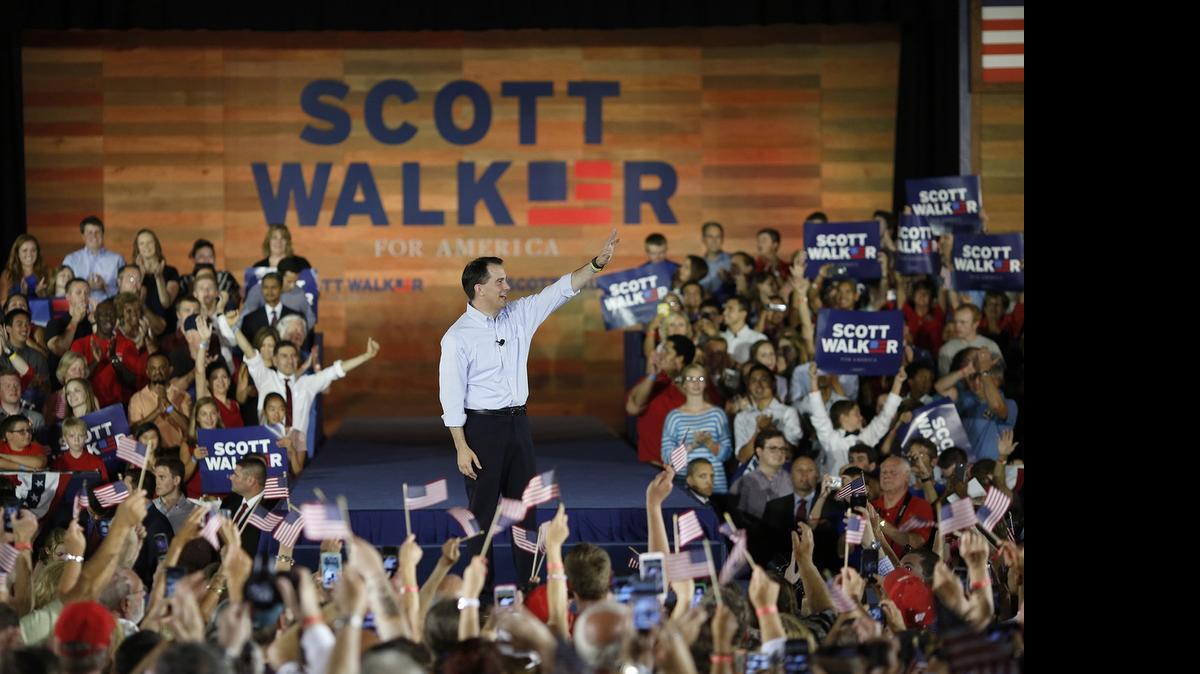 
Scott Walker waves to the crowd as he announces his presidential candidacy in Waukesha, Wisconsin, Monday.
