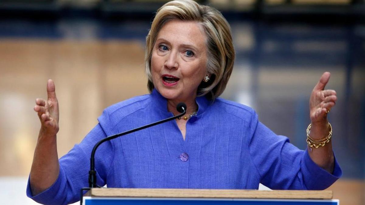 
Hillary Rodham Clinton answers reporters’ questions about Republican presidential candidate Donald Trump after announcing her college affordability plan, Monday, Aug. 10, 2015, at the high school in Exeter, N.H.
