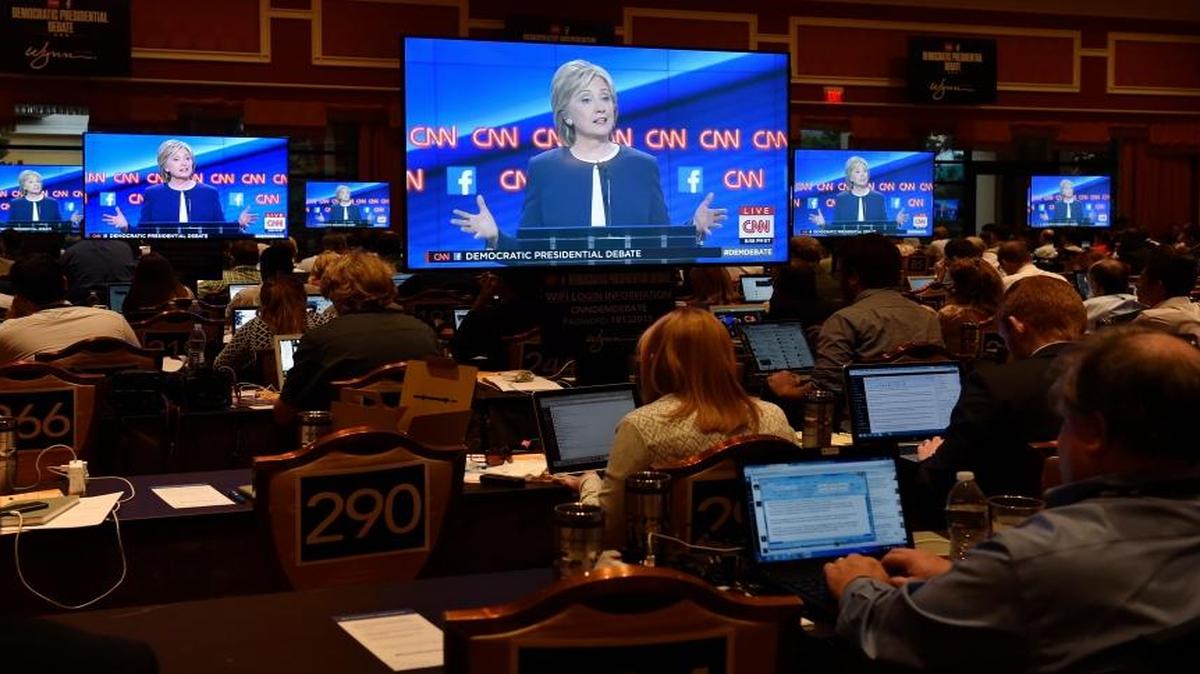 "I am a progressive, but I am a progressive who likes to get things done, and I how to find common ground, and I know how to stand my ground, and I have proved that in all of the positions I've had," said Hillary Rodham Clinton as the media work during the CNN Democratic presidential debate Tuesday, Oct. 13, 2015, in Las Vegas.