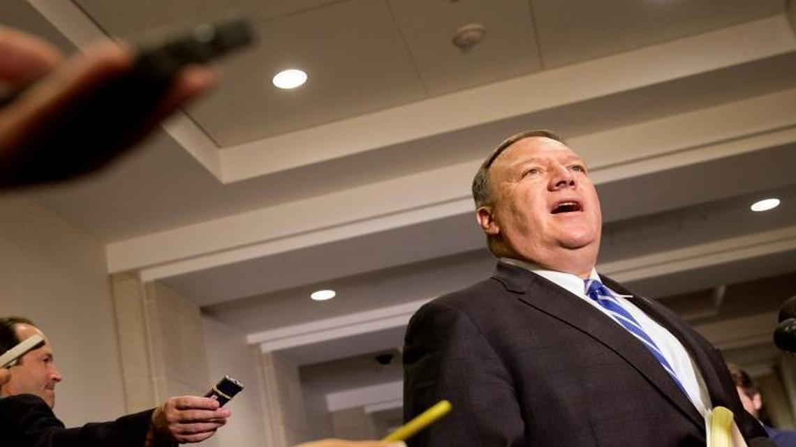 Reporters hold out recorders as House Benghazi Committee member Rep. Mike Pompeo, R-Kan., speaks to the media on Capitol Hill in Washington, Oct. 16, 2015.
