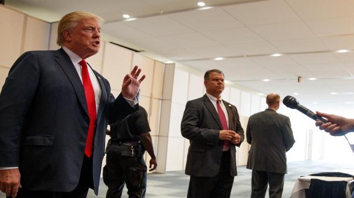 Republican presidential candidate Donald Trump speaks with reporters before the start of a town hall event, Monday, Aug. 1, 2016, in Columbus, Ohio