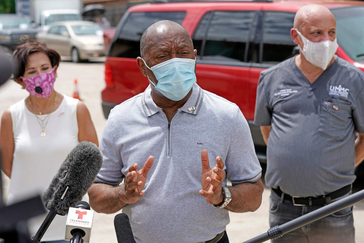 FILE - In this June 28, 2020 file photo, Houston Mayor Sylvester Turner speaks in Houston. Houston officials have canceled the Texas GOP’s in-person convention. They say the spread of the coronavirus made it impossible to hold the event as scheduled. Mayor Turner said Wednesday, July 8, 2020, that the city’s lawyers exercised provisions in the contract that the Texas Republican Party signed to rent the downtown convention center for a three-day event to have started July 16. Virus cases have surged in Texas, particularly in the state’s largest cities. (AP Photo/David J. Phillip File)