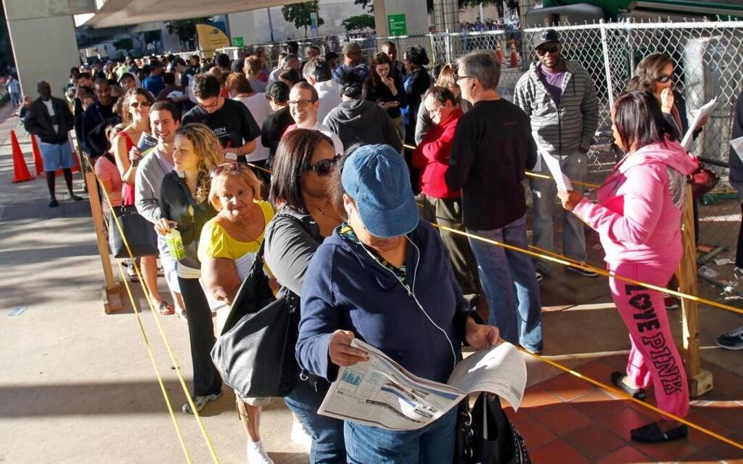 South Floridians stand in line during the last day of early voting in Miami, Saturday, Nov. 3, 2012.