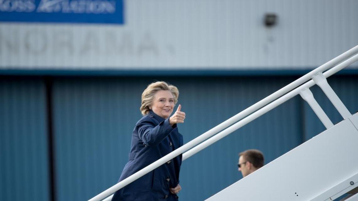 Democratic presidential candidate Hillary Clinton gives a thumbs up to members of the media as she boards her campaign plane in White Plains, N.Y., Tuesday, Oct. 4, 2016, to travel to Philadelphia International Airport. Clinton is attending rallies in Haverford, Pa. and Harrisburg, Pa.