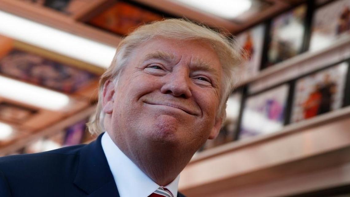 Republican presidential candidate Donald Trump smiles as he listens to a reporter’s question at Geno's Steaks, Thursday, Sept. 22, 2016, in Philadelphia. Trump faces Hillary Clinton in Monday’s presidential debate.