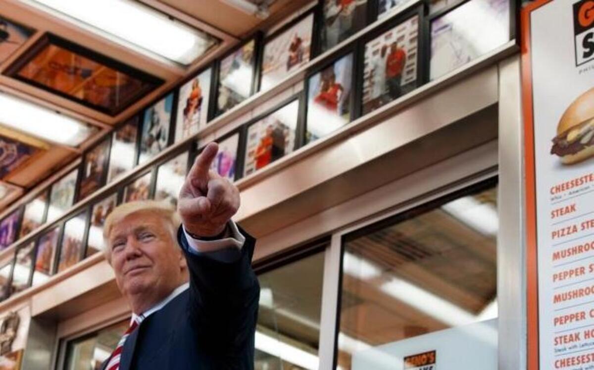 Republican presidential candidate Donald Trump talks with customers during a visit to Geno's Steaks, Thursday, Sept. 22, 2016, in Philadelphia.