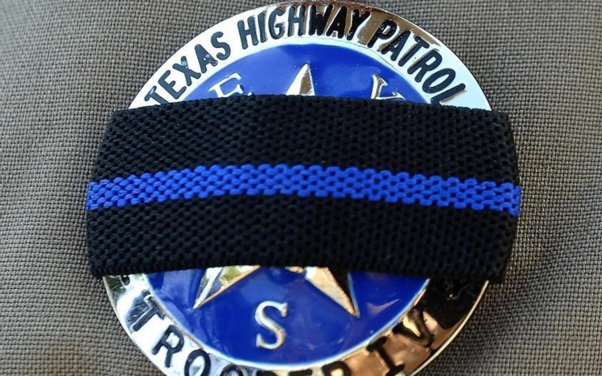 Texas troopers provide security at the shooting site in Dallas on Friday, July 8, 2016. On Thursday, 12 police officers were shot, five fatally, before police killed a gunman early Friday.