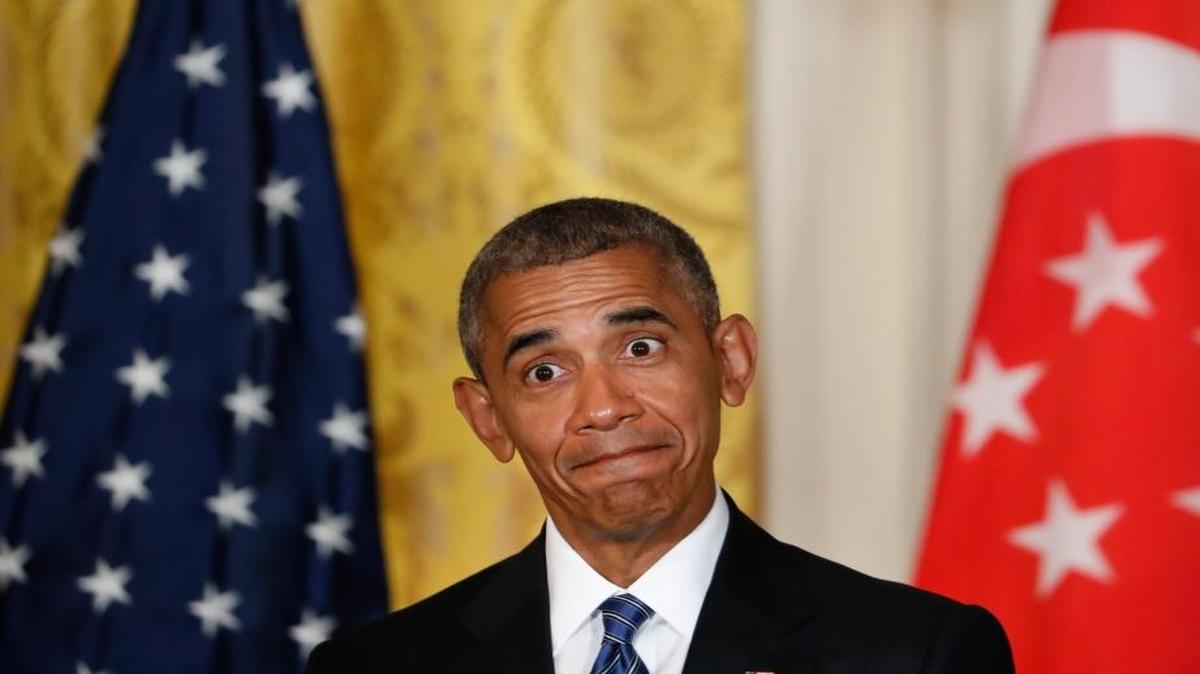 President Barack Obama reacts to questions asked by members of the media during a joint news conference with Singapore's Prime Minister Lee Hsien Loong in the East Room of the White House.