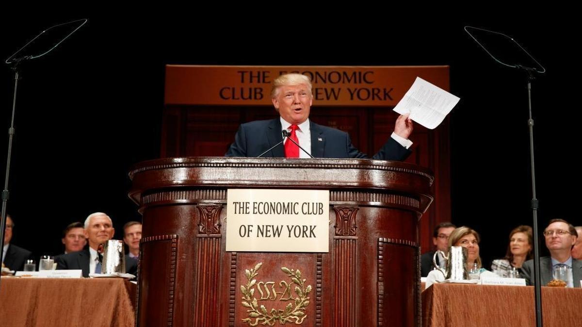 Republican presidential candidate Donald Trump hold up notes as he speaks to the Economic Club of New York, Thursday, Sept. 15, 2016, in New York.