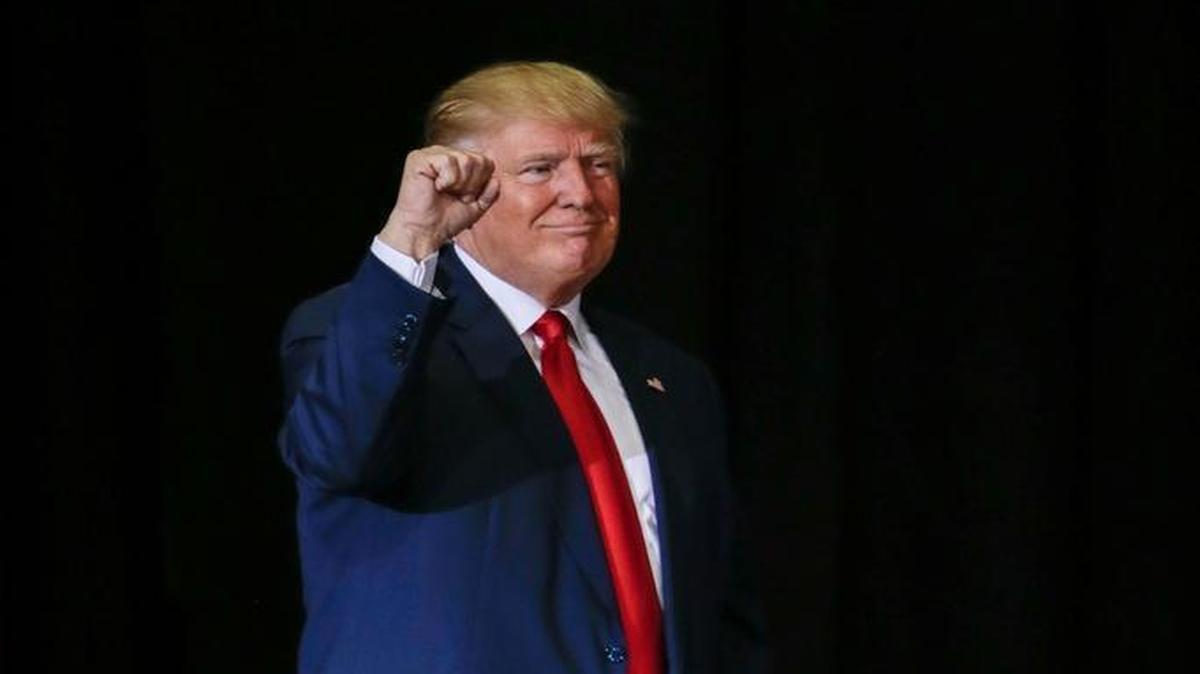 Republican presidential candidate Donald Trump raises his fist after speaks at a campaign rally in Grand Rapids, Mich., Monday, Oct. 31, 2016.