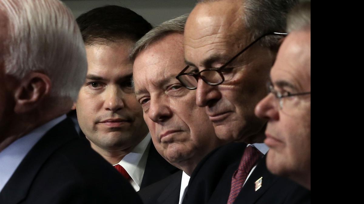 
U.S. Sens. Marco Rubio (R-Fla.), Richard Durbin (D-Ill.), Charles Schumer (D-N.Y.), and Robert Menendez (D-N.J.) listen during a news conference on immigration reform April 18, 2013, on Capitol Hill in Washington, D.C.
