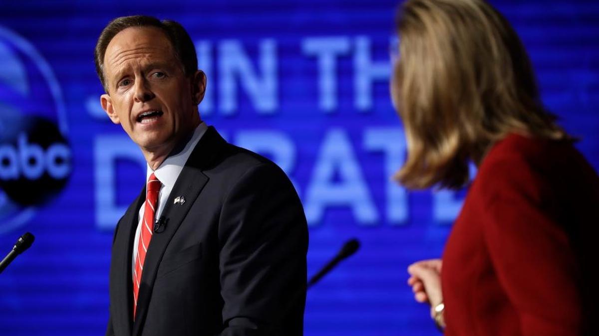 Pennsylvania U.S. Senate candidates Republican Sen. Pat Toomey, left, and Democrat Katie McGinty take part in a debate at Temple University in Philadelphia, Monday, Oct. 24, 2016.