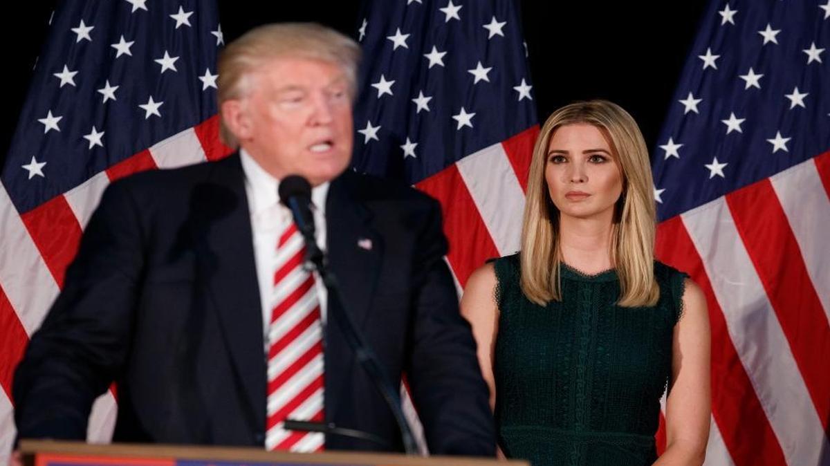 Ivanka Trump, right, looks on as her father, Republican presidential candidate Donald Trump, delivers a policy speech on child care in Pennsylvania Tuesday.