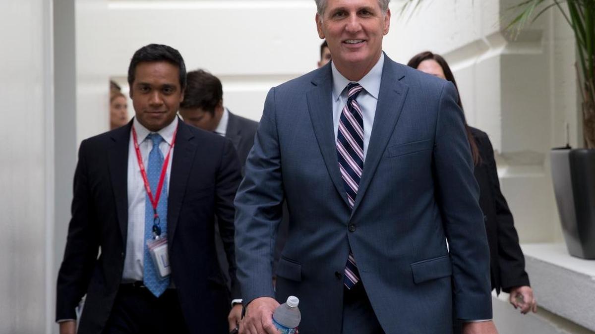 
House Majority Leader Kevin McCarthy of Calif., right, arrives for a House Republican Conference on Capitol Hill in Washington, Tuesday, Sept. 29, 2015. McCarthy is assuring Republicans he can bring them together, even as emboldened conservatives maneuver to yank their party to the right in the wake of the leader of the U.S. House of Representatives Speaker John Boehner's sudden resignation. 
