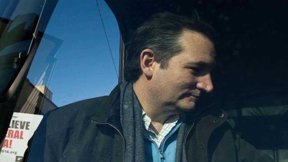 Republican presidential candidate Sen. Ted Cruz of Texas boards his campaign bus after a rally Friday, Jan. 29, 2016, in Fenton, Iowa.