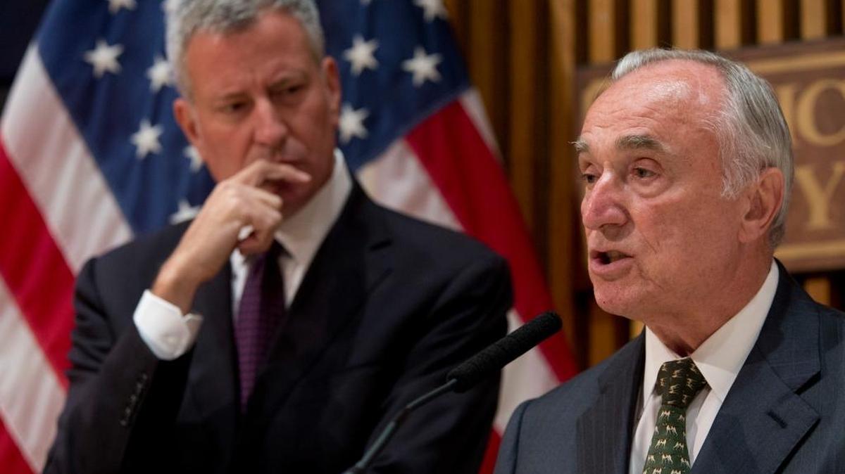 New York City Police Commissioner William Bratton is joined by Mayor Bill de Blasio during a news conference on Friday in New York. The NYPD is stepping up measures in the wake of the attack on Dallas police. Bratton said officers will double up on patrols for their safety and police presence will be increased at protests.