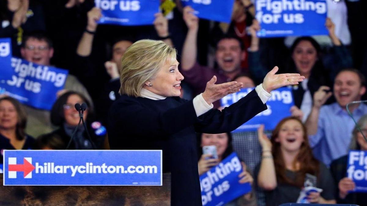 Democratic presidential candidate Hillary Clinton gestures to supporters at her New Hampshire presidential primary campaign rally, Tuesday, Feb. 9, 2016, in Hooksett, New Hampshire.
