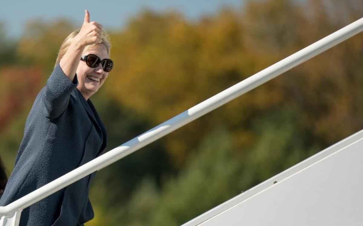 Democratic presidential candidate Hillary Clinton boards her campaign plane at Westchester County Airport in White Plains, N.Y., Tuesday to travel to Las Vegas for the third presidential debate.