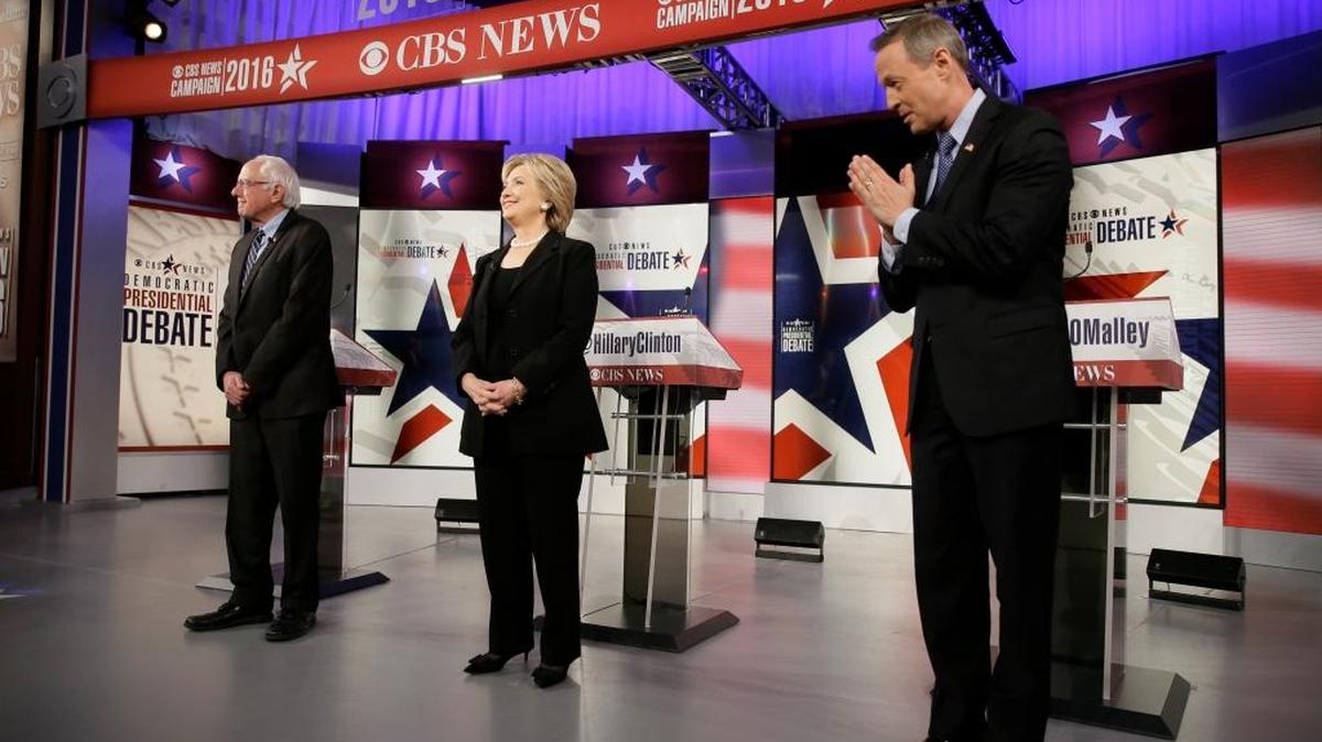 Democratic presidential candidates Bernie Sanders, left, Hillary Rodham Clinton and Martin O'Malley take the stage before a Democratic presidential primary debate, Saturday, Nov. 14, 2015, in Des Moines, Iowa.