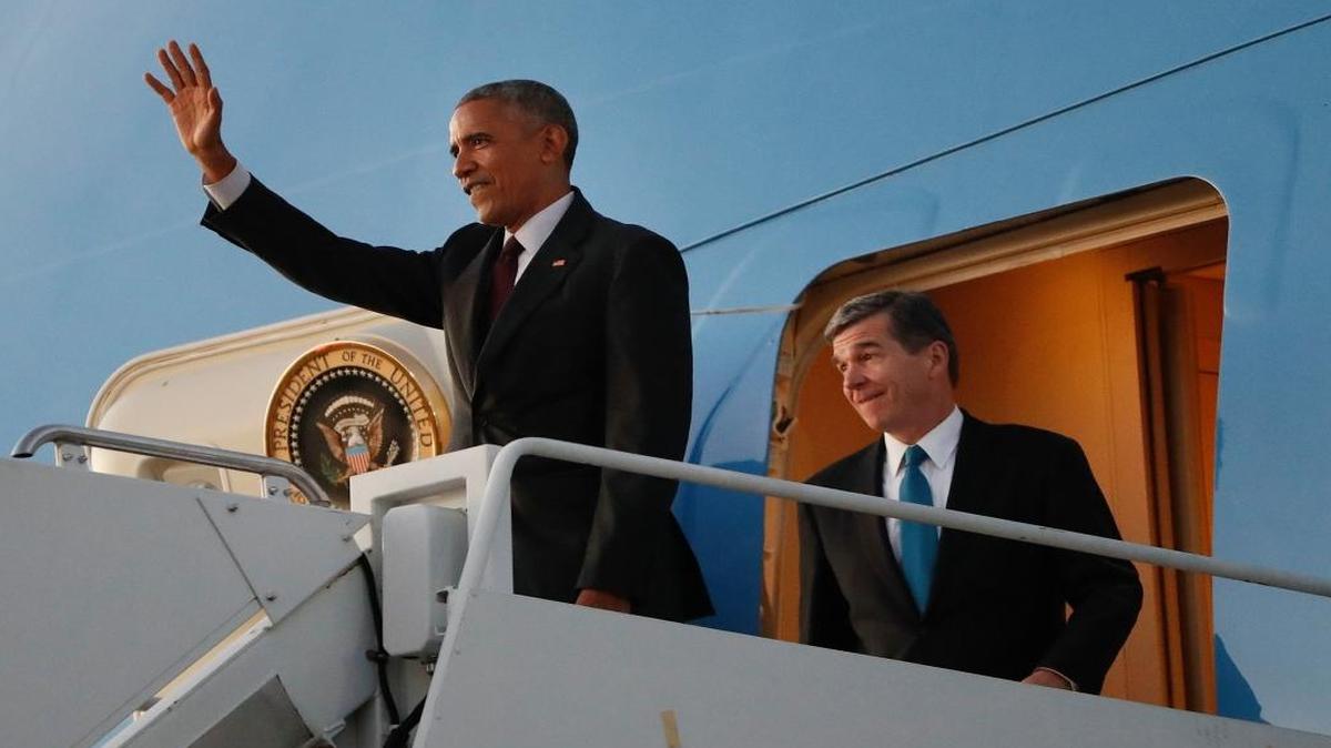 President Barack Obama, left, and North Carolina Democratic gubernatorial candidate Roy Cooper, right, arrive together at North Carolina Air National Guard Base in Charlotte. North Carolina is a key state to watch as returns come in Tuesday night.