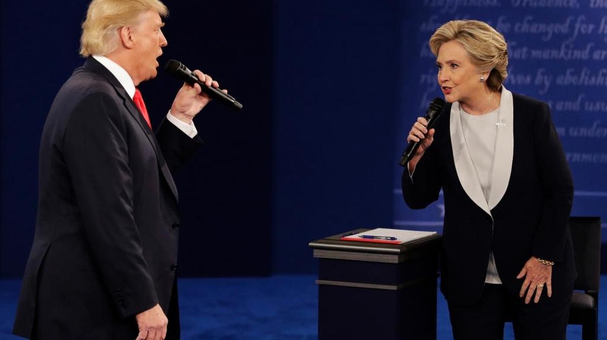 In this Sunday, Oct. 9, 2016, file photo, Republican presidential nominee Donald Trump and Democratic presidential nominee Hillary Clinton speak during the second presidential debate at Washington University in St. Louis.