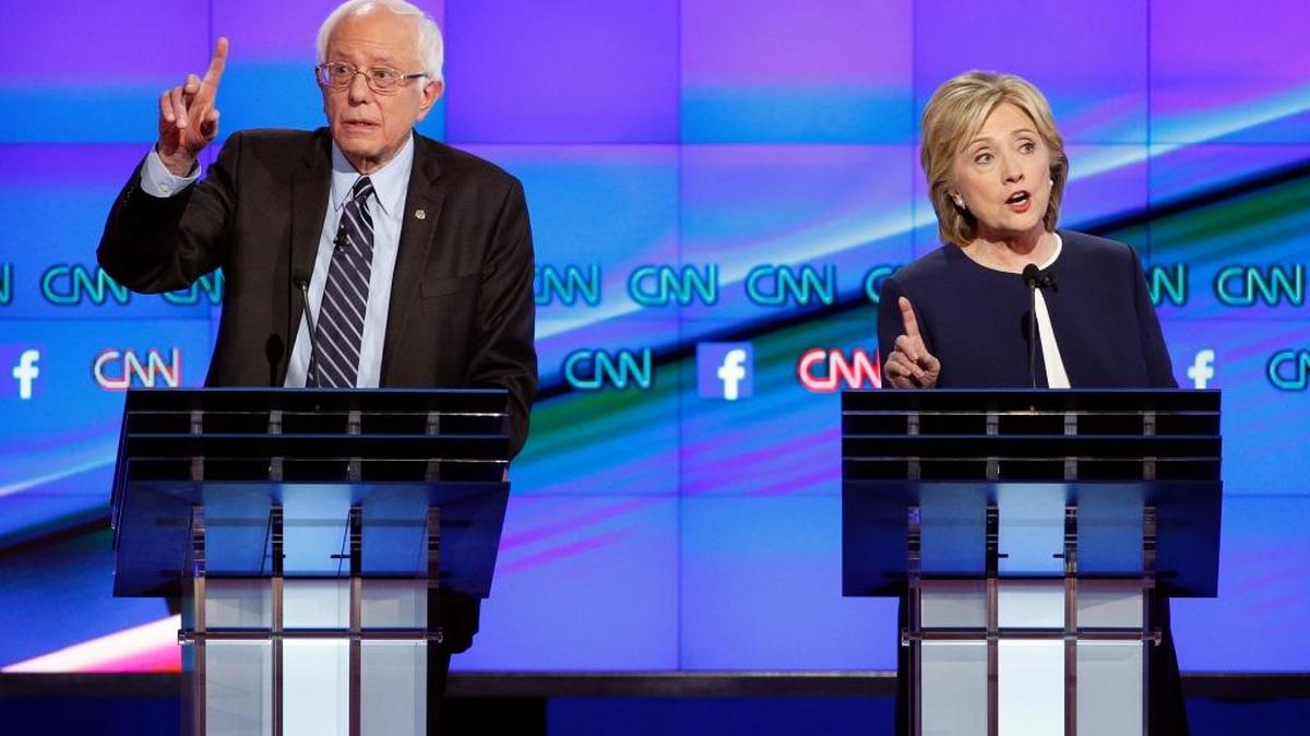 
Hillary Clinton and Sen. Bernie Sanders, of Vermont speak during the CNN Democratic presidential debate Tuesday in Las Vegas.
