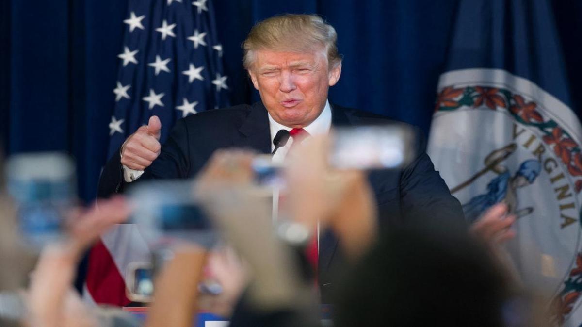 Republican presidential candidate Donald Trump gives a thumbs-up while speaking during a campaign rally at the Prince William County Fair Ground in Manassas, Va., Wednesday, Dec. 2, 2015.