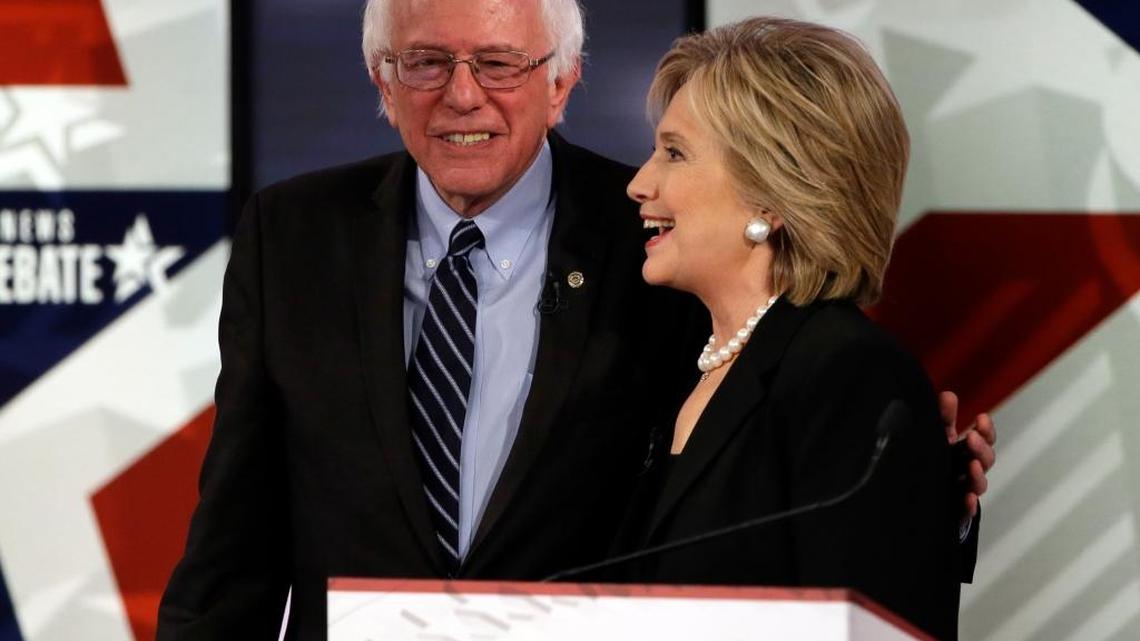 Hillary Rodham Clinton, right, talks to Bernie Sanders after a Democratic presidential primary debate, Saturday, Nov. 14, 2015, in Des Moines, Iowa.
