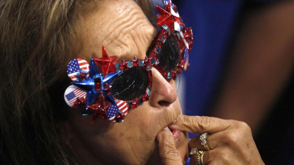 A delegate whistles as roll call votes are cast during the second day of the Republican National Convention in Cleveland, Tuesday, July 19, 2016.