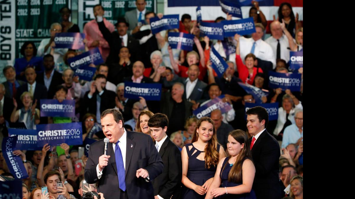 
New Jersey Gov. Chris Christie, accompanied by his family, speaks to supporters during an event announcing he will seek the Republican nomination for president, Tuesday, June 30, 2015, at Livingston High School in Livingston, N.J. 
