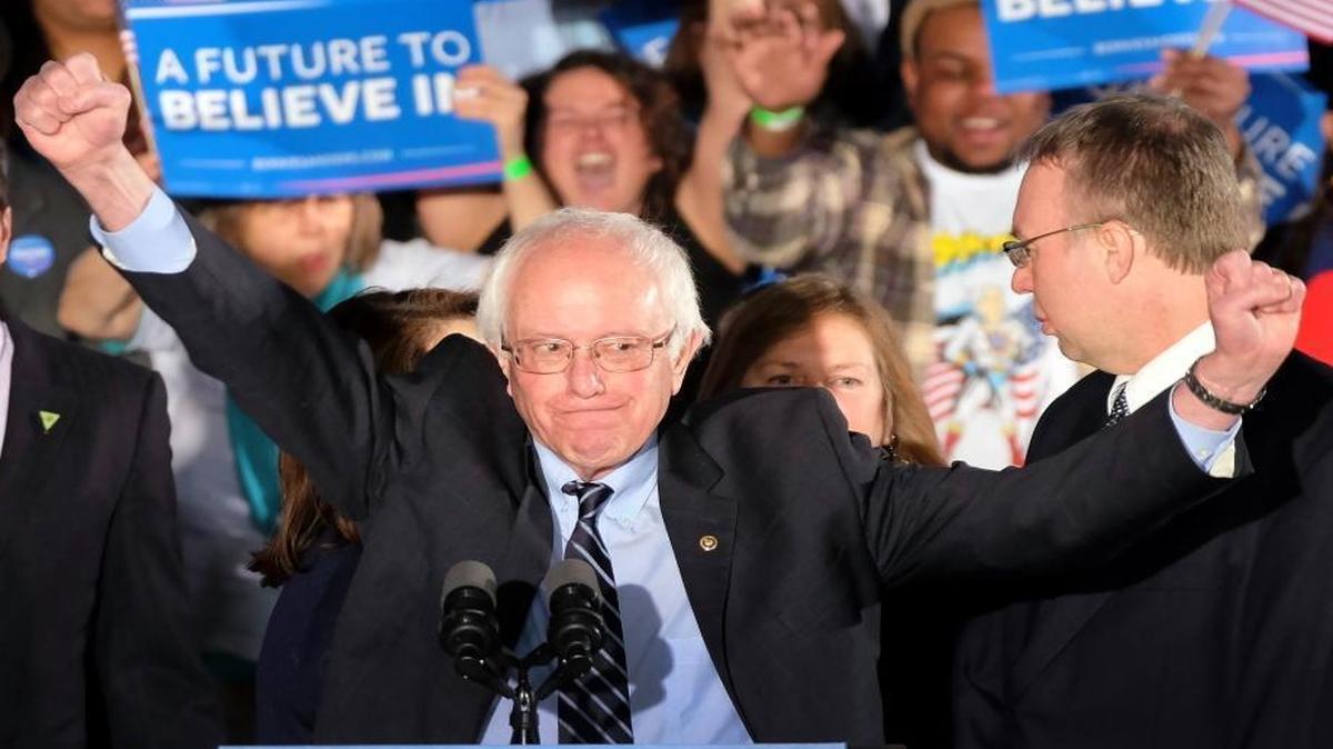Democratic presidential candidate, Sen. Bernie Sanders, I-Vt., reacts to the cheering crowd at his primary night rally Tuesday, Feb. 9, 2016, in Manchester, N.H.