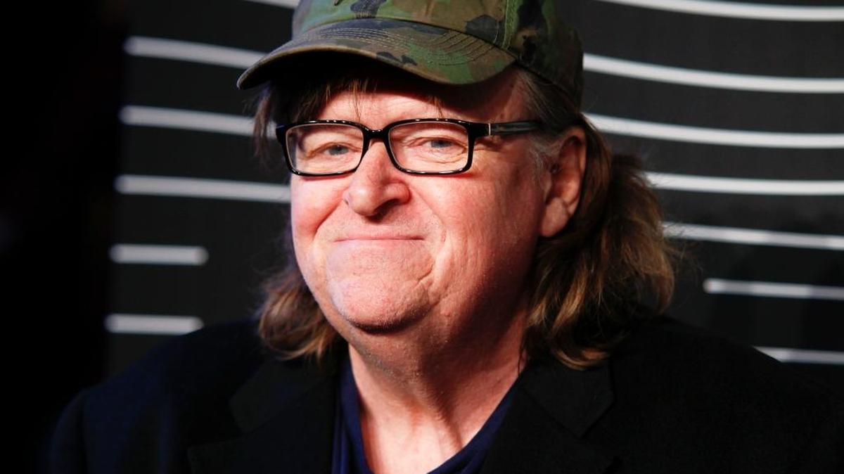 FILE - In this May 16, 2016 file photo, Michael Moore attends the 20th Annual Webby Awards at Cipriani Wall Street in New York. Moore premiered a surprise film about the U.S. presidential election on Tuesday, Oct. 18, 2016. "Michael Moore in TrumpLand" features a one-man stage show of Moore discussing the race.