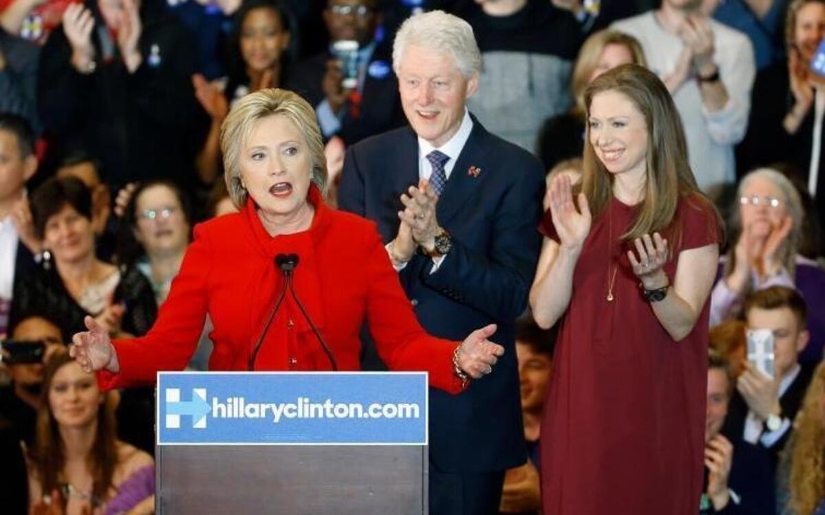 Democratic presidential candidate Hillary Clinton speaks in front of former President Bill Clinton and daughter Chelsea during a caucus night rally at Drake University in Des Moines, Iowa, Monday, Feb. 1, 2016.