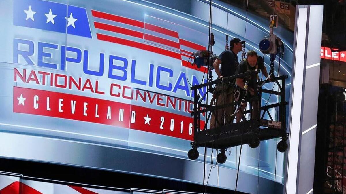 The main stage on the convention floor at the Quicken Loans Arena in downtown Cleveland, Ohio, is prepared for the upcoming Republican National Convention, as workers stand in a man lift on Wednesday, July 13, 2016.