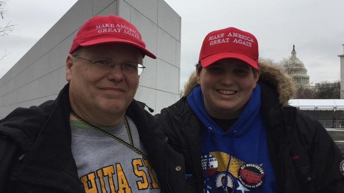 Allen Olson, left, and his son, Paddy, of Wichita, Kansas, attended Friday’s inauguration of Donald Trump.
