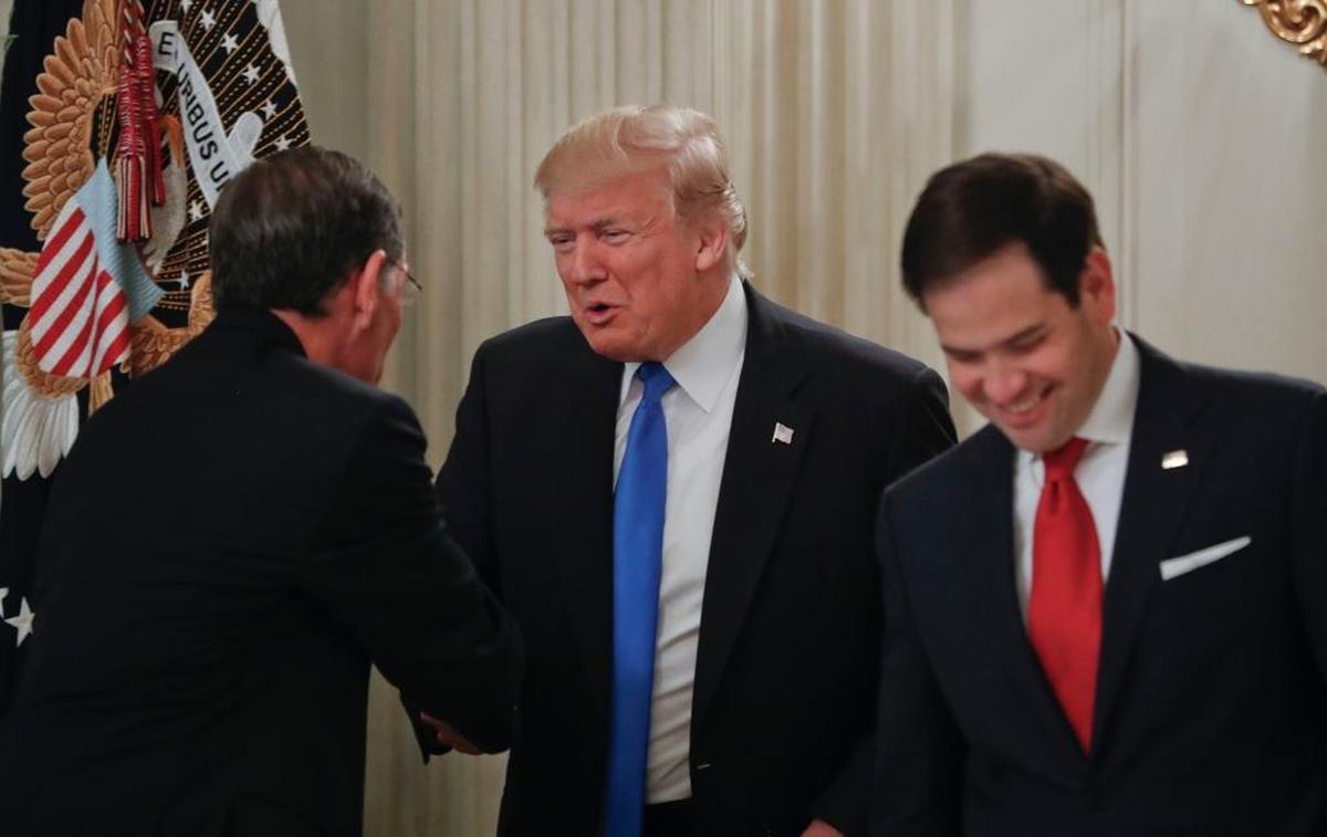 President Donald Trump greets Sen. John Barrasso, R-Wyo., left, and Sen. Marco Rubio, R-Fla. during a White House luncheon Wednesday.