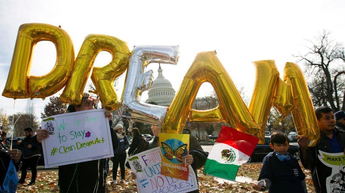 Demonstrators hold up balloons during an immigration rally in support of the Deferred Action for Childhood Arrivals (DACA), and Temporary Protected Status (TPS), programs, near the U.S. Capitol in Washington, Wednesday, Dec. 6, 2017.