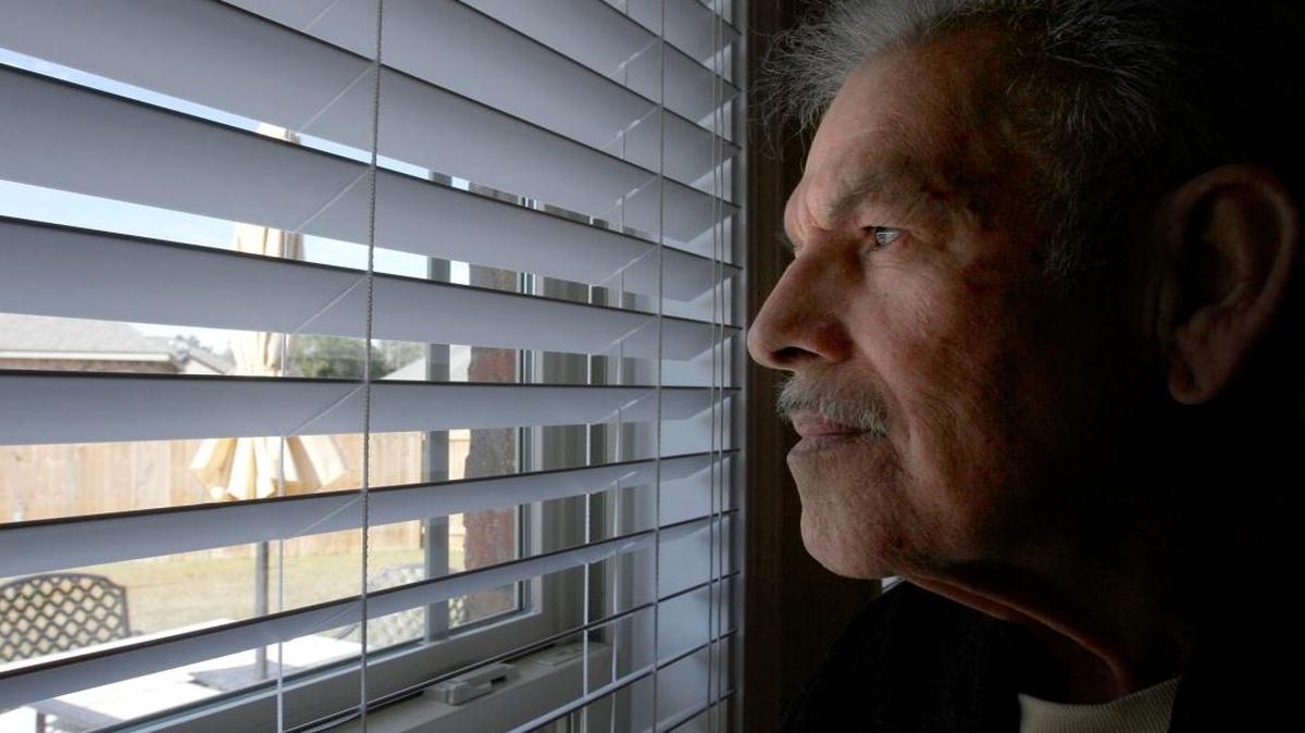Lionel Sosa looks out the back window of his home in Gulfport, Miss., Wednesday, Nov. 23, 2016. Sosa is a 78-year-old veteran, diagnosed with terminal cancer, who has been fighting for PTSD benefits.