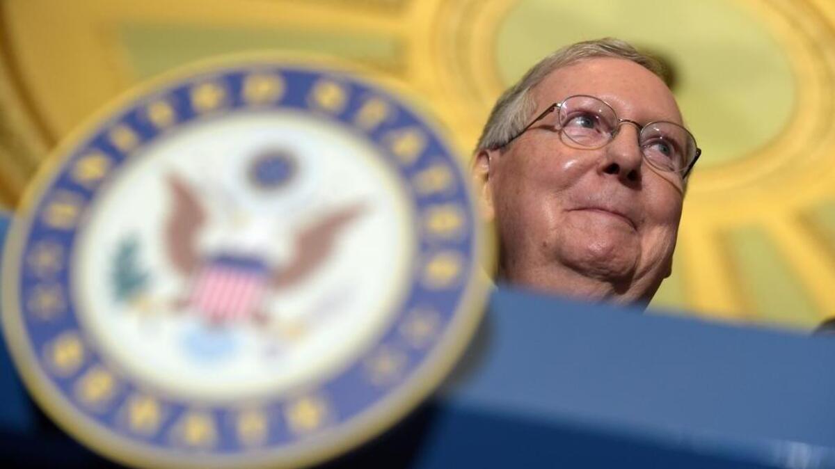Senate Majority Leader Mitch McConnell of Ky. smiles during a news conference on Capitol Hill in Washington, on Feb. 7.