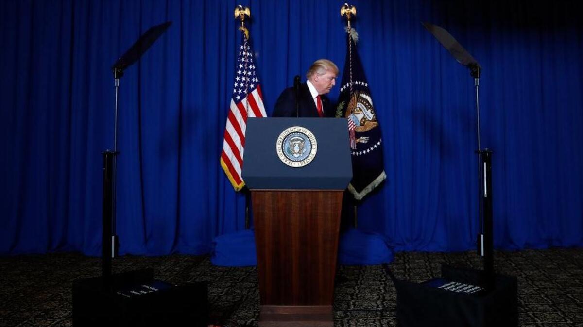 In this April 6, 2017, photo, President Donald Trump walks from the podium after speaking at Mar-a-Lago in Palm Beach, Fla., Thursday, April 6, 2017, after the U.S. fired a barrage of cruise missiles into Syria.